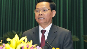 Tổng Thanh tra Chính phủ Huỳnh Phong Tranh trình bày Báo cáo về công tác phòng, chống tham nhũng năm 2013 (ảnh: Đăng Khoa). 
