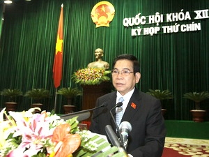 Chủ tịch nước Nguyễn Minh Triết trình bày Báo cáo công tác nhiệm kỳ 2007-2011 của Chủ tịch nước.
